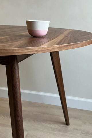 Round black walnut dining table