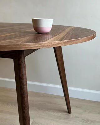 Round black walnut dining table