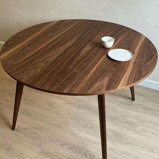 Round black walnut dining table