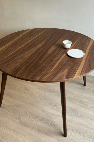 Round black walnut dining table