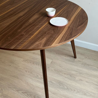 Round black walnut dining table