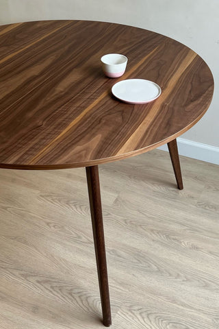 Round black walnut dining table