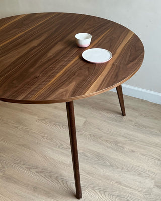 Round black walnut dining table