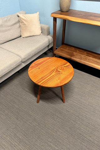 Round walnut color wood coffee table