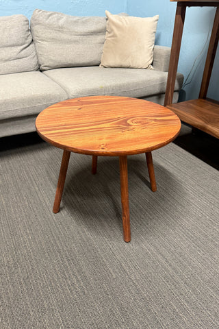 Round walnut color wood coffee table