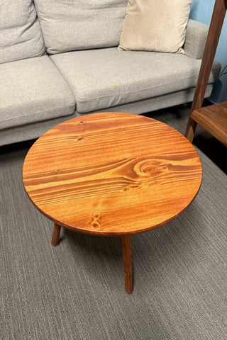 Round walnut color wood coffee table